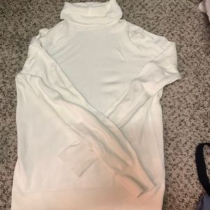 Cream turtleneck sweater, thinner material could be layered